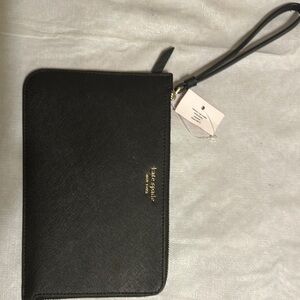 Kate Spade Black Wristlet with a zip closure ext pocket and int card card slots